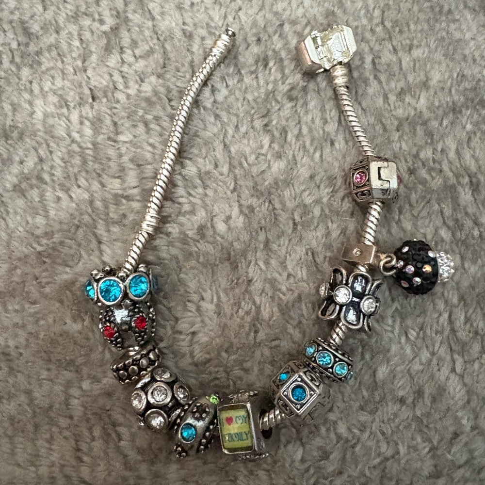 GUC silver tone charm bracelet